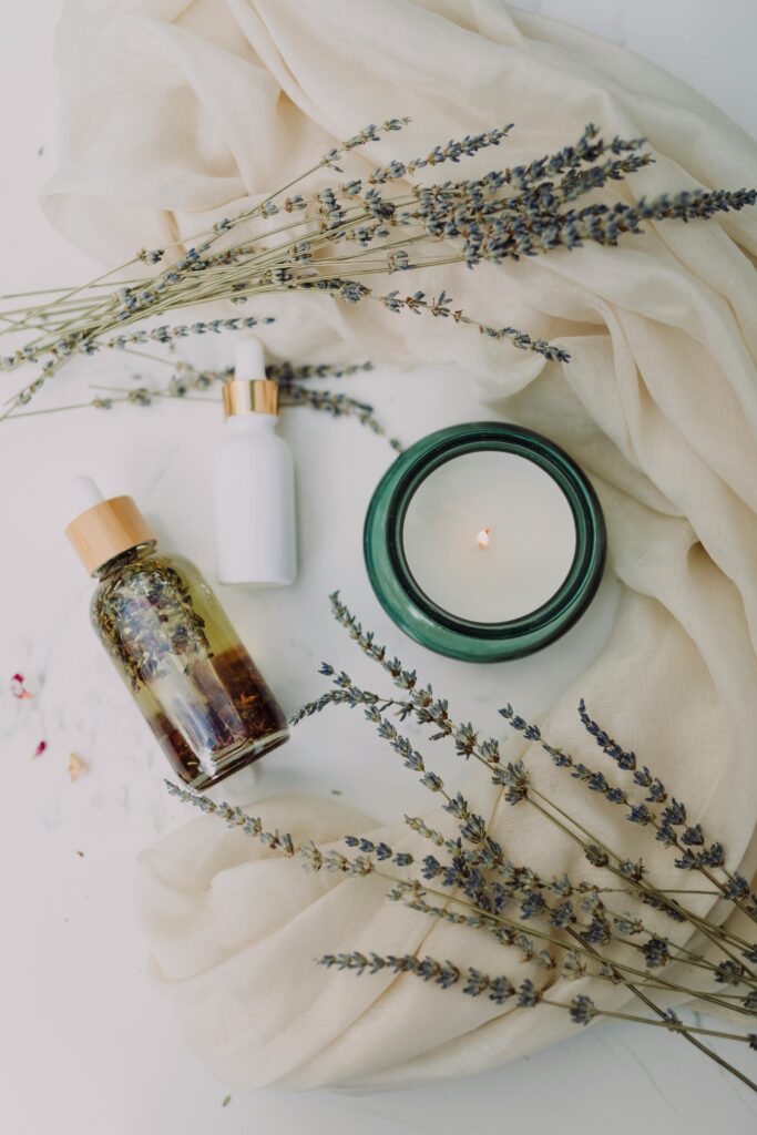 candle, lavender, and oils indicating a relaxing evening, or a moment to slow down and take care of oneself